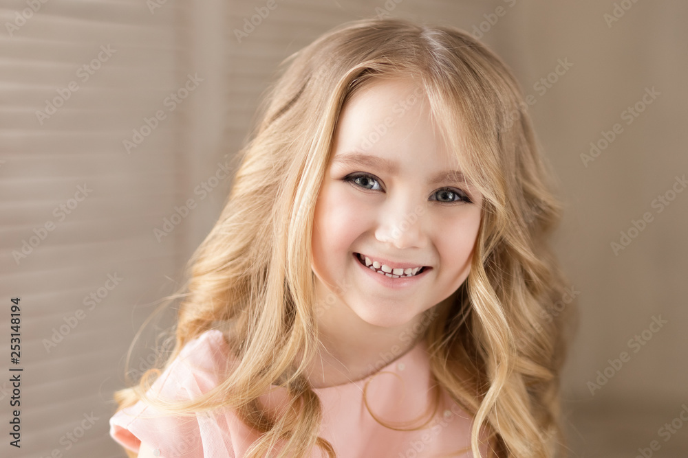 Portrait of beautiful pretty girl, smiling. Indoor photo. Close-up.