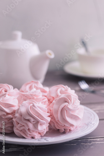 Traditional Russian homemade merengue marshmallow or zephyr on a plate on wooden background