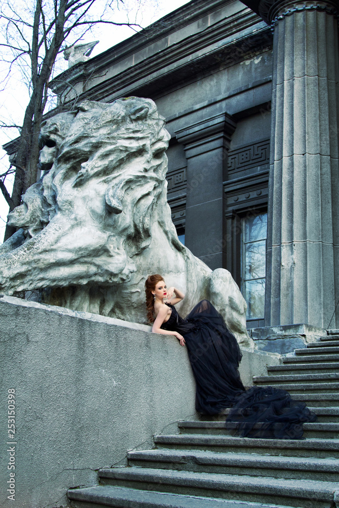 Art work Gothic fashion: a beautiful young girl in black dress and headwear sitting near castle. Toned and noise added. Art work Gothic fashion: a beautiful young girl in black dress and headwear sitting near castle. Toned and noise added.