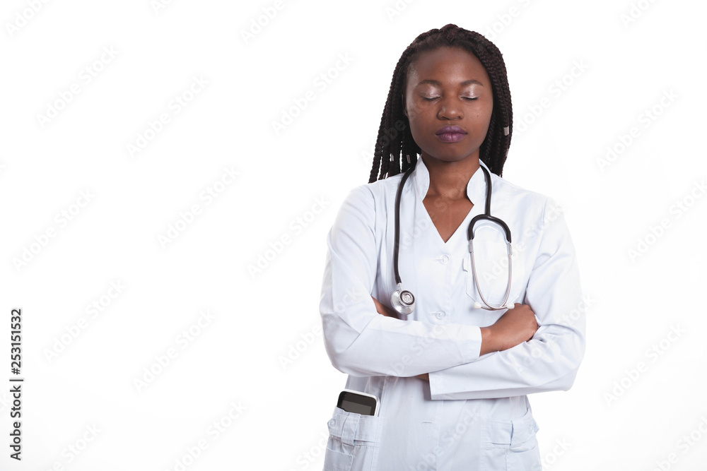 Female american african doctor, nurse woman wearing medical coat with stethoscope and tablet in poket. Serious excited for success medical worker posing on light background Female american african doctor, nurse woman wearing medical coat with stethoscope and tablet in poket. Serious excited for success medical worker posing on light background