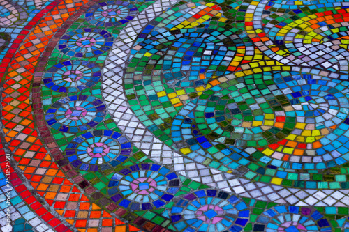 Beautiful colorful round mosaic with bright stones in circular patterns
