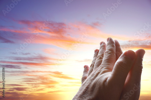 Prayer hands in sky