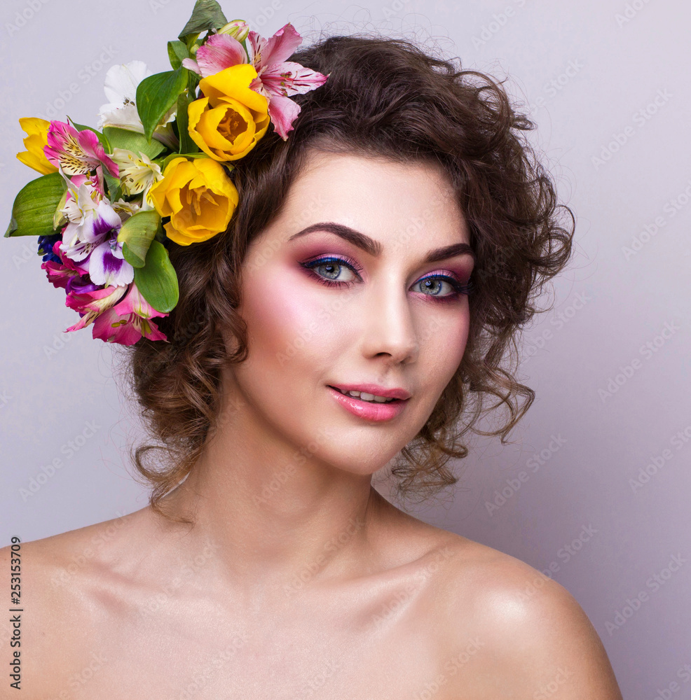 Beautiful Girl with Spring Flowers. Fresh skin