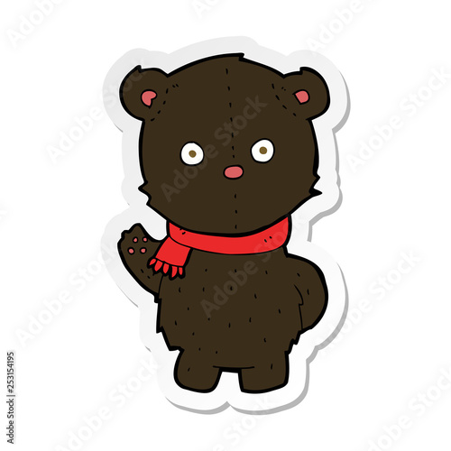 sticker of a cartoon waving black bear cub