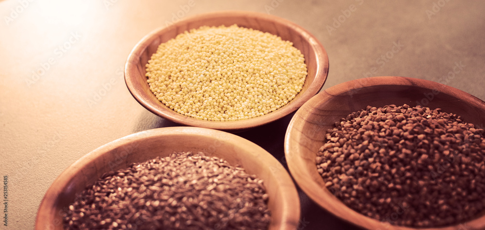 Collection of different groats, buckwheat, flax, in bowls. Set of Groats and Grains. Collection of different groats, buckwheat, flax, in bowls. Set of Groats and Grains.