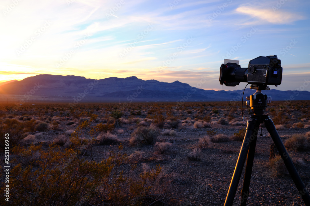 Camera Set Up on Tripod Near Mountains Camera Set Up on Tripod Near Mountains