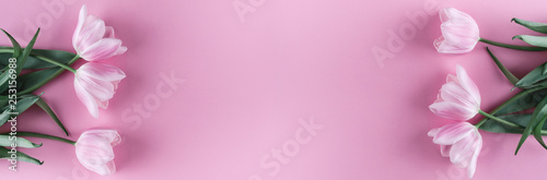 Fototapeta Naklejka Na Ścianę i Meble -  Pink tulips flowers on pink background. Card for Mothers day, 8 March, Happy Easter. Waiting for spring. Greeting card or wedding invitation. Flat lay, top view