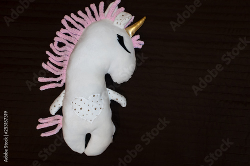 White soft unicorn toy with pink mane