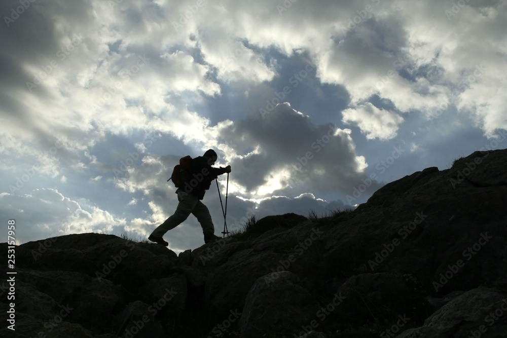 a mountaineer in mount, silhouette
