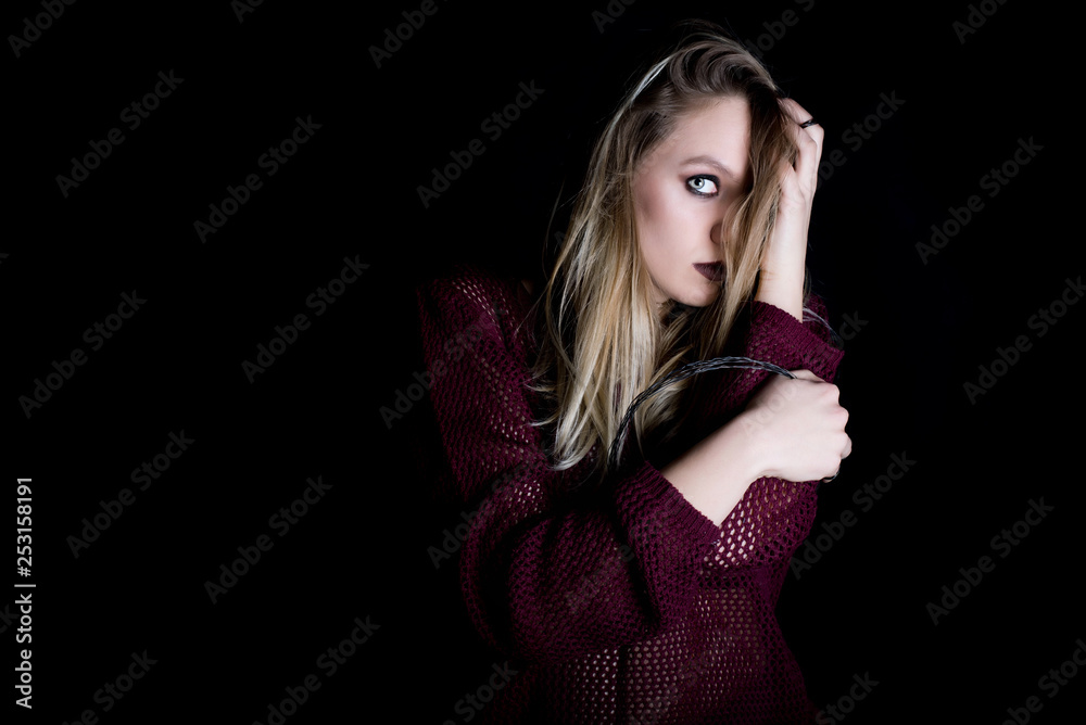 Girl with satan makeup on dark black background. Girl with satan makeup on dark black background.