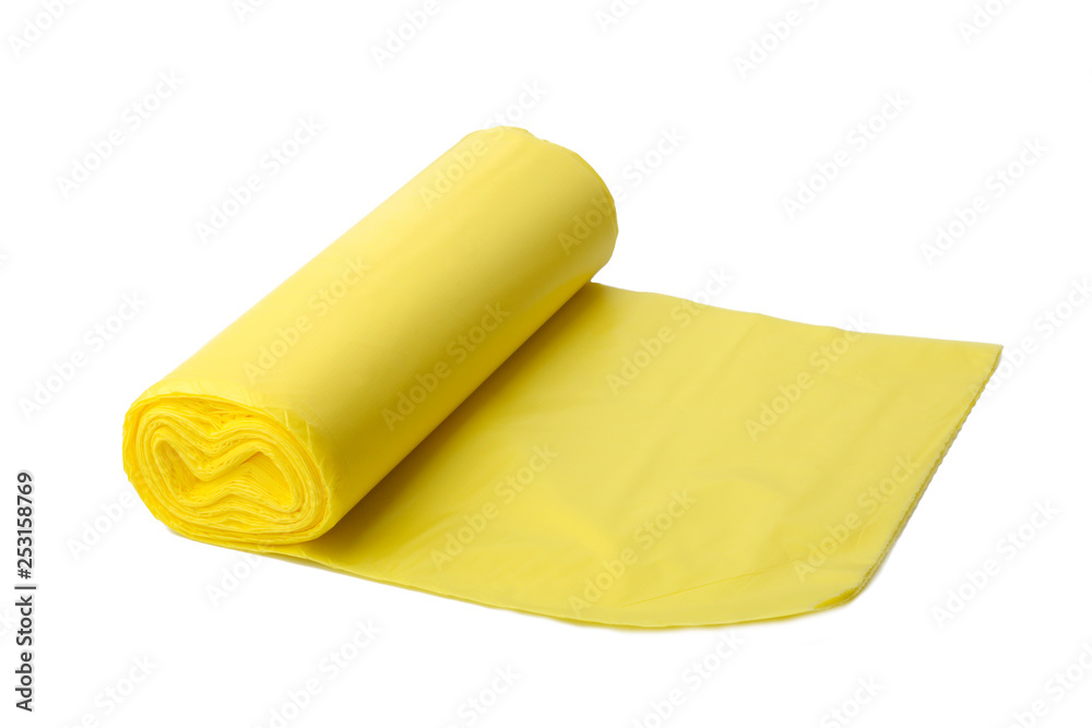 Trash bags. Roll of yellow plastic garbage bags isolated on white background. Trash bags. Roll of yellow plastic garbage bags isolated on white background.