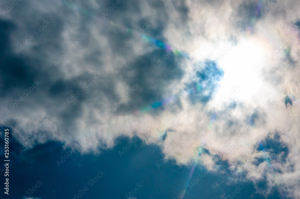 massive sunstar lens effect cloudy sky sun
