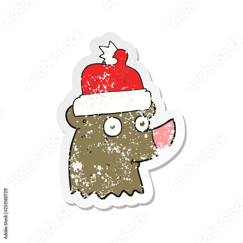 retro distressed sticker of a cartoon bear wearing christmas hat