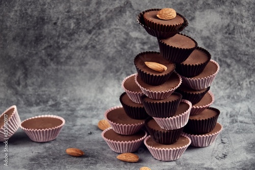 Keto Chocolate Almond Butter Fat Bombs. Paleo diet chocolate isolated on grey background photo