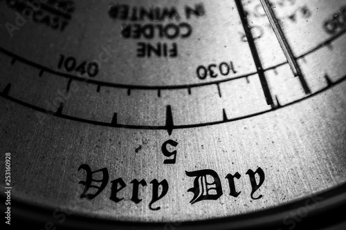 Old barometer with the focus on the words very dry