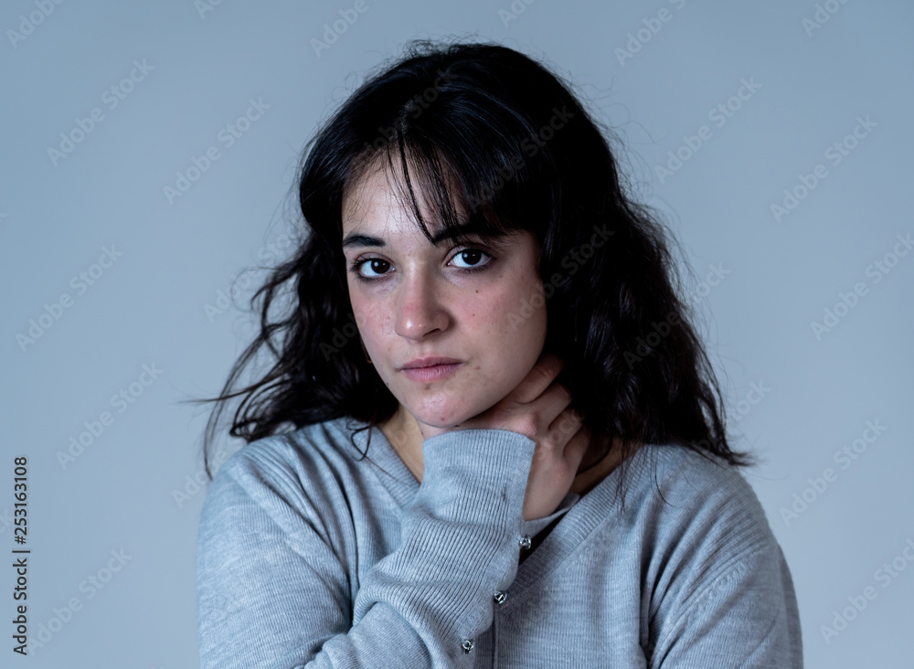 Human expressions and emotions. Young attractive woman with sad and depressed expression Human expressions and emotions. Young attractive woman with sad and depressed expression