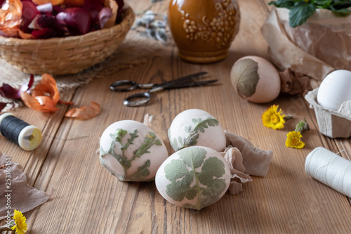 Preparation of Easter eggs for dying with onion peels