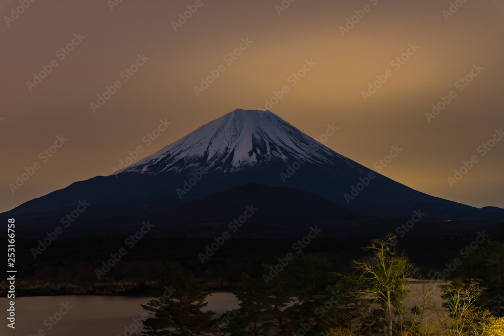 Mount Fuji at twilight after sunset, the World Heritage, view in Lake Shoji ( Shojiko ). Fuji Five Lake region, Minamitsuru District, Yamanashi prefecture, Japan. Landscape for travel destination.