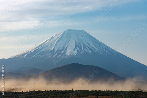 Close up Mount Fuji with natural fine sand flying up in the air. Landscape of The World Heritage. view at Lake Shoji ( Shojiko ) in the morning. Fuji Five Lake region, Minamitsuru, Yamanashi, Japan.