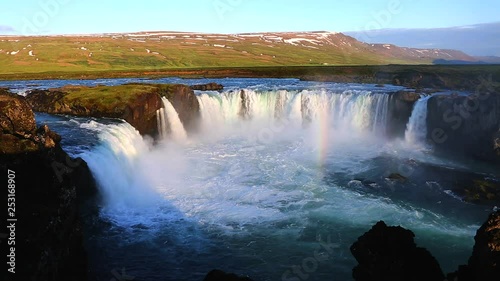 Nice views of the bright sunlit powerful Godafoss cascade. Location Bardardalur valley of Iceland. photo