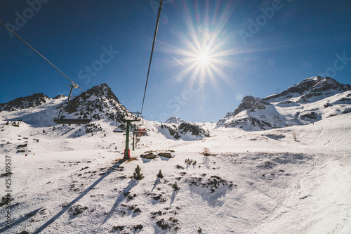Formigal, Spain - 23 February 2019: View of a chairlift in Formigal Ski Resort, Pyrenees, Spain. Beautiful view from the chair. photo