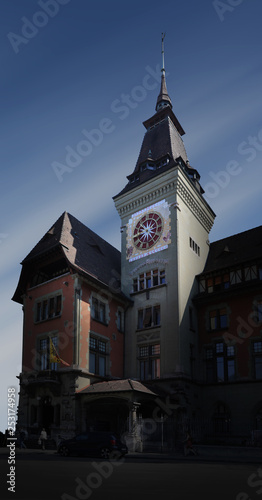Switzerland, Geneva - 06 20 2018: Town hall of Geneva's 'Eaux-Vives' quarter with its clock tower photo