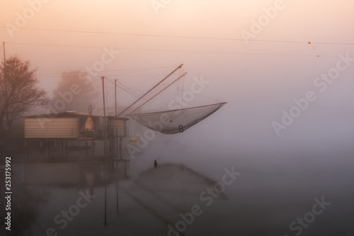 Italia, marzo 2019 - tipici casoni da pesca con particolari reti a bilancia a Comacchio in provincia di Ferrara nella regione Emilia Romagna photo