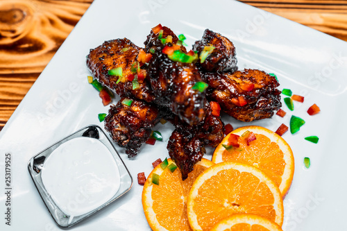 Spicy Jerk Chicken Wings plated with TLC