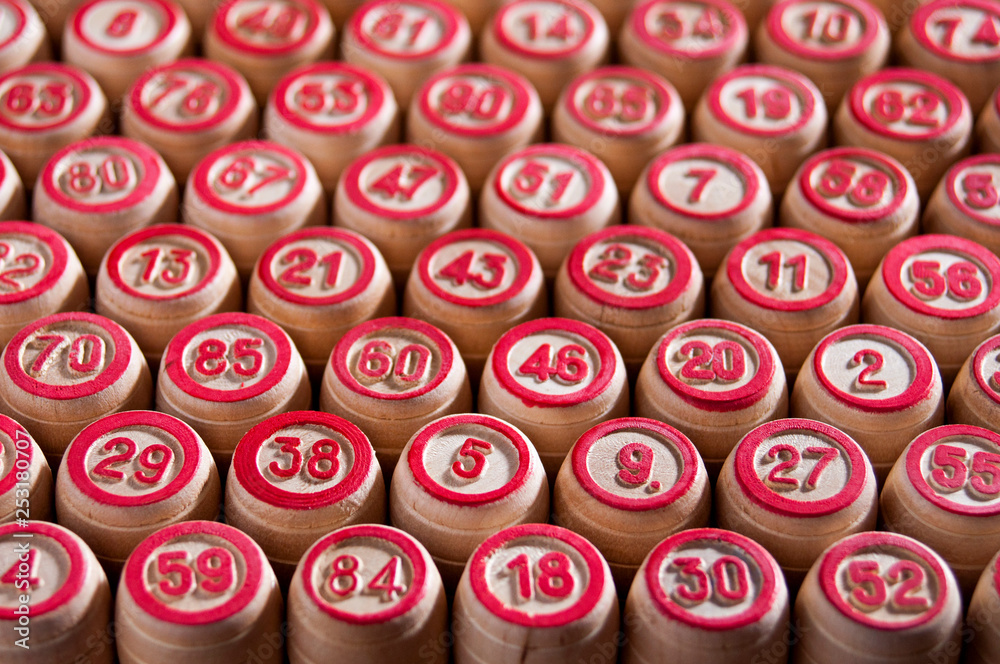 Board game lotto. Background. The barrels for the game are lined up in even diagonal rows. Excitement and good luck. Group entertainment, family leisure. Board game lotto. Background. The barrels for the game are lined up in even diagonal rows. Excitement and good luck. Group entertainment, family leisure.