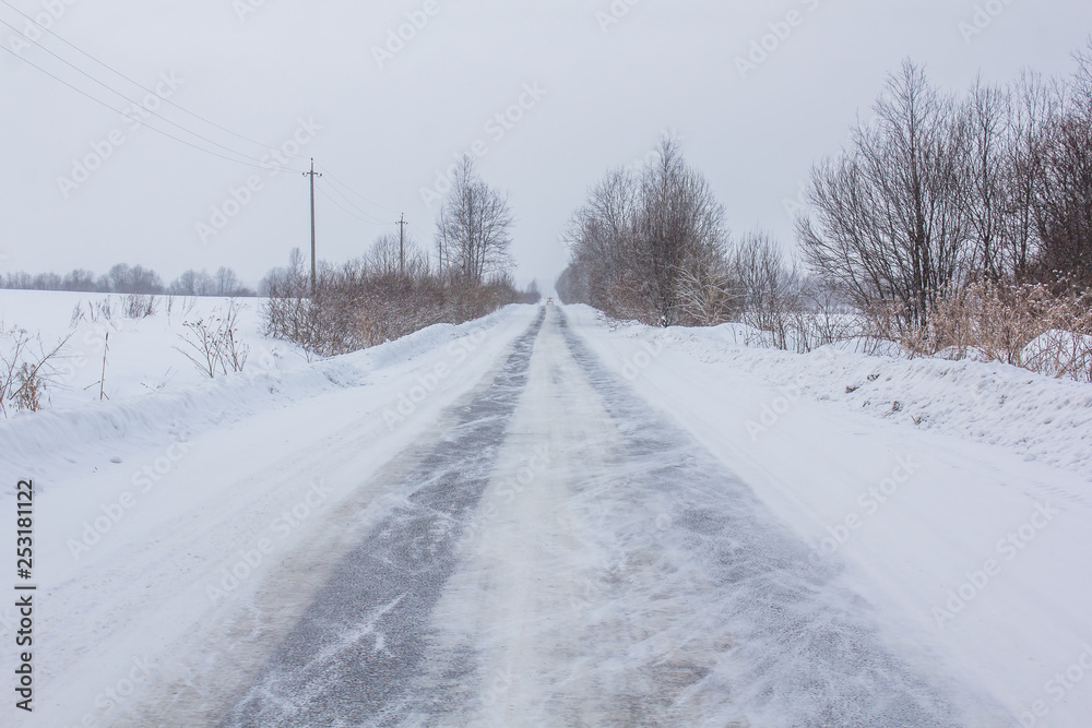 Snowy winter road. The road is covered up. Russian dear. Winter fairy tale Snowy winter road. The road is covered up. Russian dear. Winter fairy tale