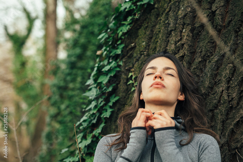 Young beautiful woman exercise in the forest