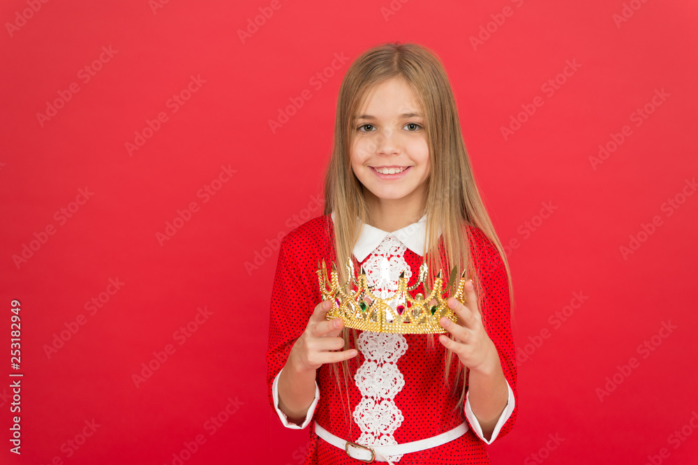 Lady little princess. Girl cute smile hold crown while stand red background. Best award for me. Kid hold golden crown symbol of princess. Happy childhood concept. Every girl dreaming become princess Lady little princess. Girl cute smile hold crown while stand red background. Best award for me. Kid hold golden crown symbol of princess. Happy childhood concept. Every girl dreaming become princess