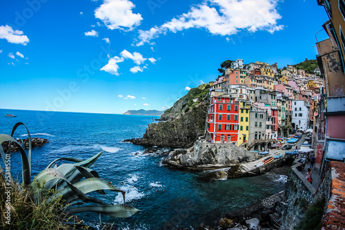 View of the beautiful seaside of Riomaggiore village in summer in the Cinque Terre area, Italy