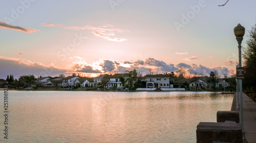 Slika na platnu Man-made lake in a park during sunset located in Elk Grove California