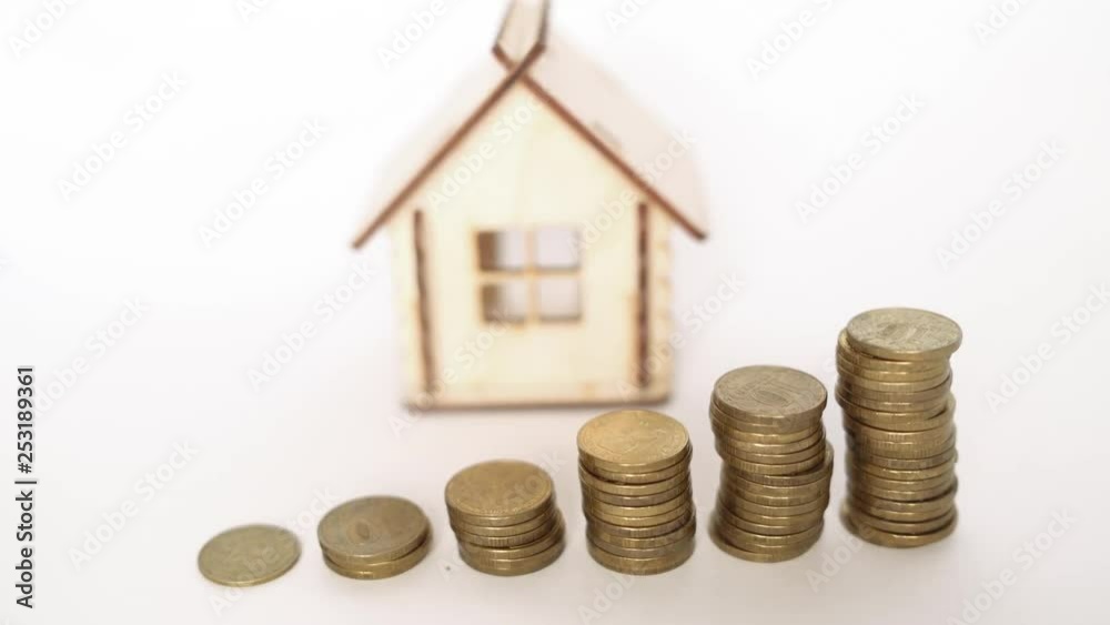 Financial real estate, gold coins and house. Concept: Property investment and house mortgage financial 