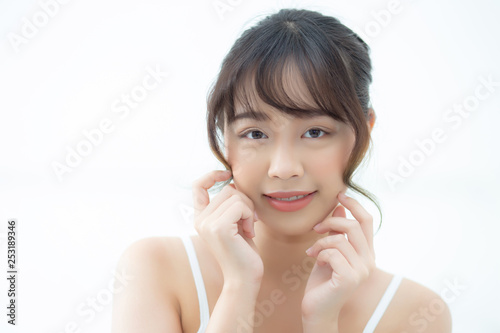 Portrait beautiful asian woman makeup of cosmetic  girl hand touch cheek and smile attractive  face beauty perfect with wellness in the bedroom at home with skin care and healthcare concept.