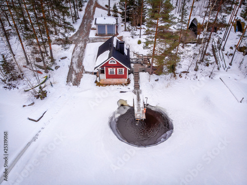 Aerial view of lake house in Finalnd in winter photo