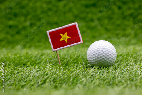 Vietnam flag with golf ball on green 