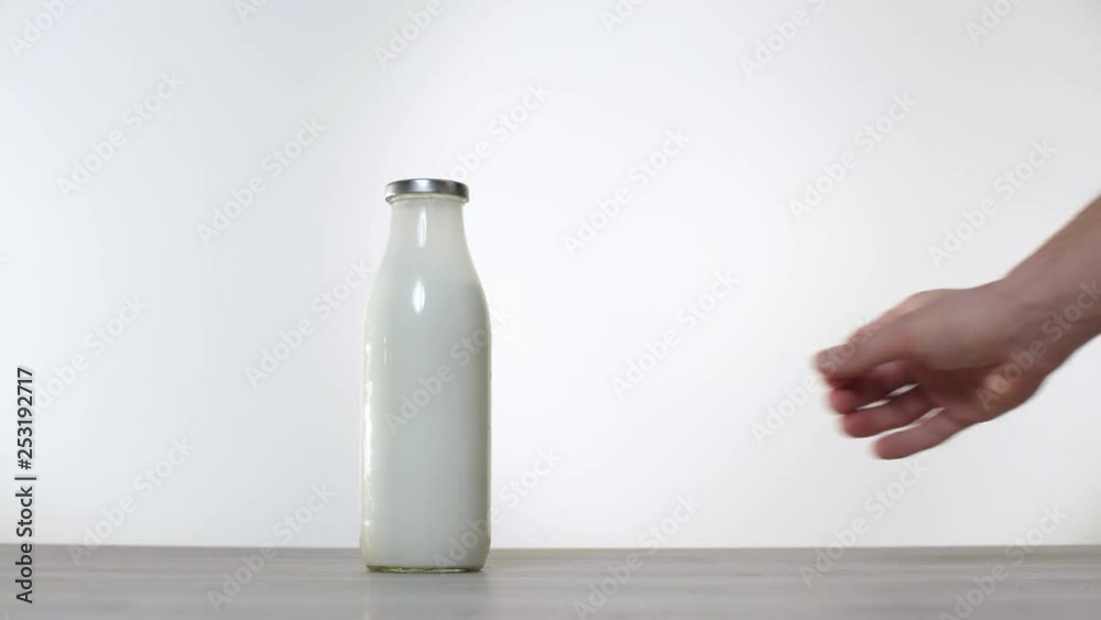 Zero waste concept Use a glass bottle instead of a plastic bottle for milk. Green and conscious lifestyle concept. Studio shot. Reusable on the go drink container ideas. Glass bottle against plastic