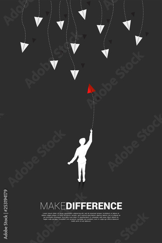 silhouette of businessman throw out red origami paper airplane go different way from group of white. Business Concept of disruption and vision mission.