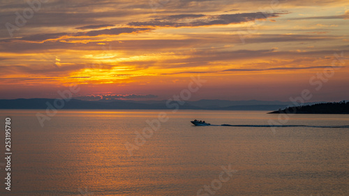 Sunset on the St. Lawrence River from Kamouraska, Quebec © Dan Tiégo