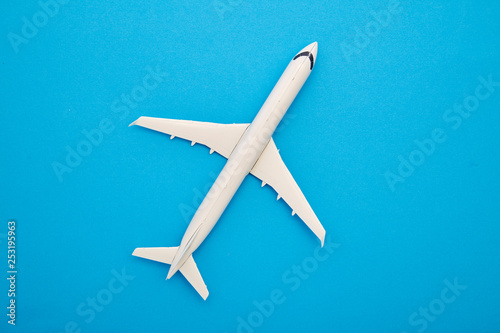 white airplane on a blue background