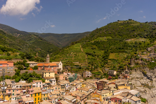 Italy, Cinque Terre, Vernazza, Vernazza, HIGH ANGLE VIEW OF TOWNSCAPE AND MOUNTAINS AGAINST SKY