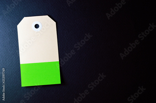 vectical clipped rectangle paper tag on dark background