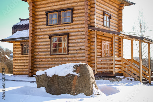 View of the wooden building of an Orthodox chapel in the city of Maloyaroslavets, Russia. Clear winter day photo