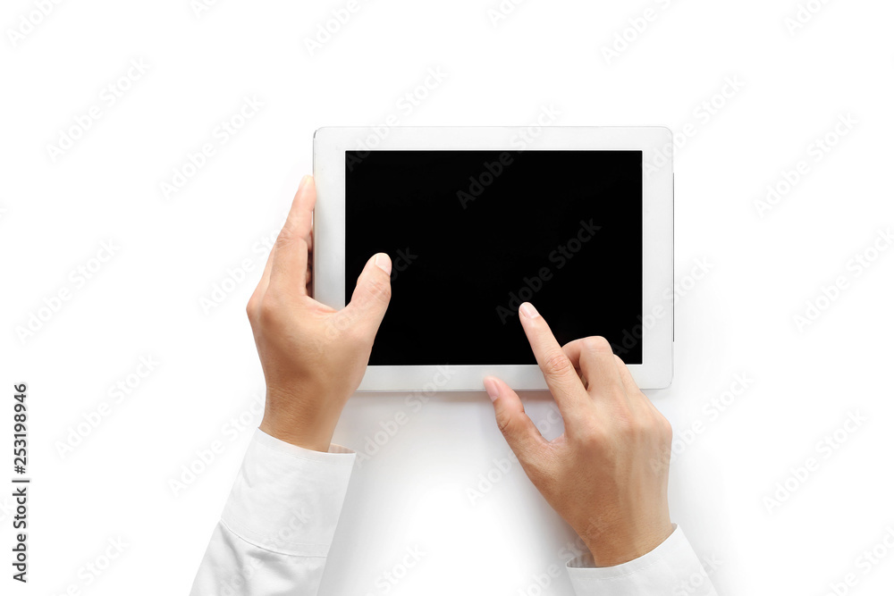 The businessman's hand uses a tablet. Isolated on a blank white background ,top view The businessman's hand uses a tablet. Isolated on a blank white background ,top view