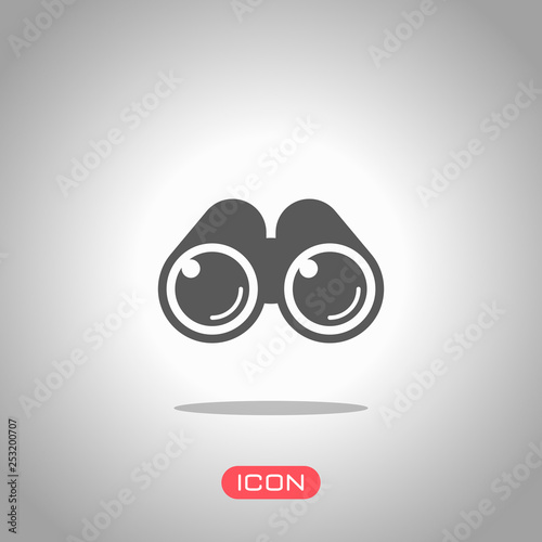 Simple binocular icon. Icon under spotlight. Gray background