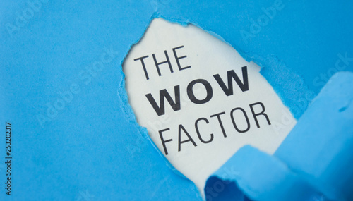 Torn paper with text The wow factor. Motivational concept
