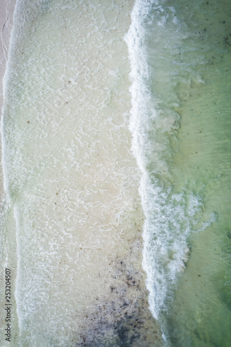 Drone waves crashing on beach