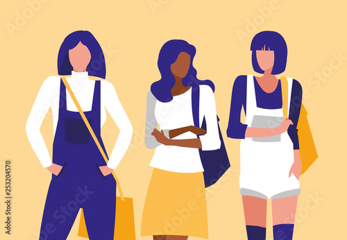 beautiful interracial girls group modeling with handbag